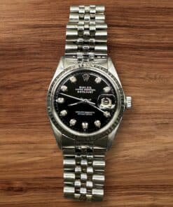 Rolex Datejust 36mm watch with diamond hour markers and stainless steel bracelet.