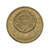 Moneda de oro de un peso mexicano con diseño del calendario azteca, primer plano.